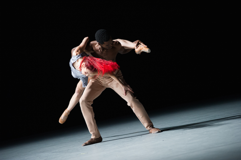 Celine Cassone drapes over Calvin Royal's mid section as he hoists her in the air